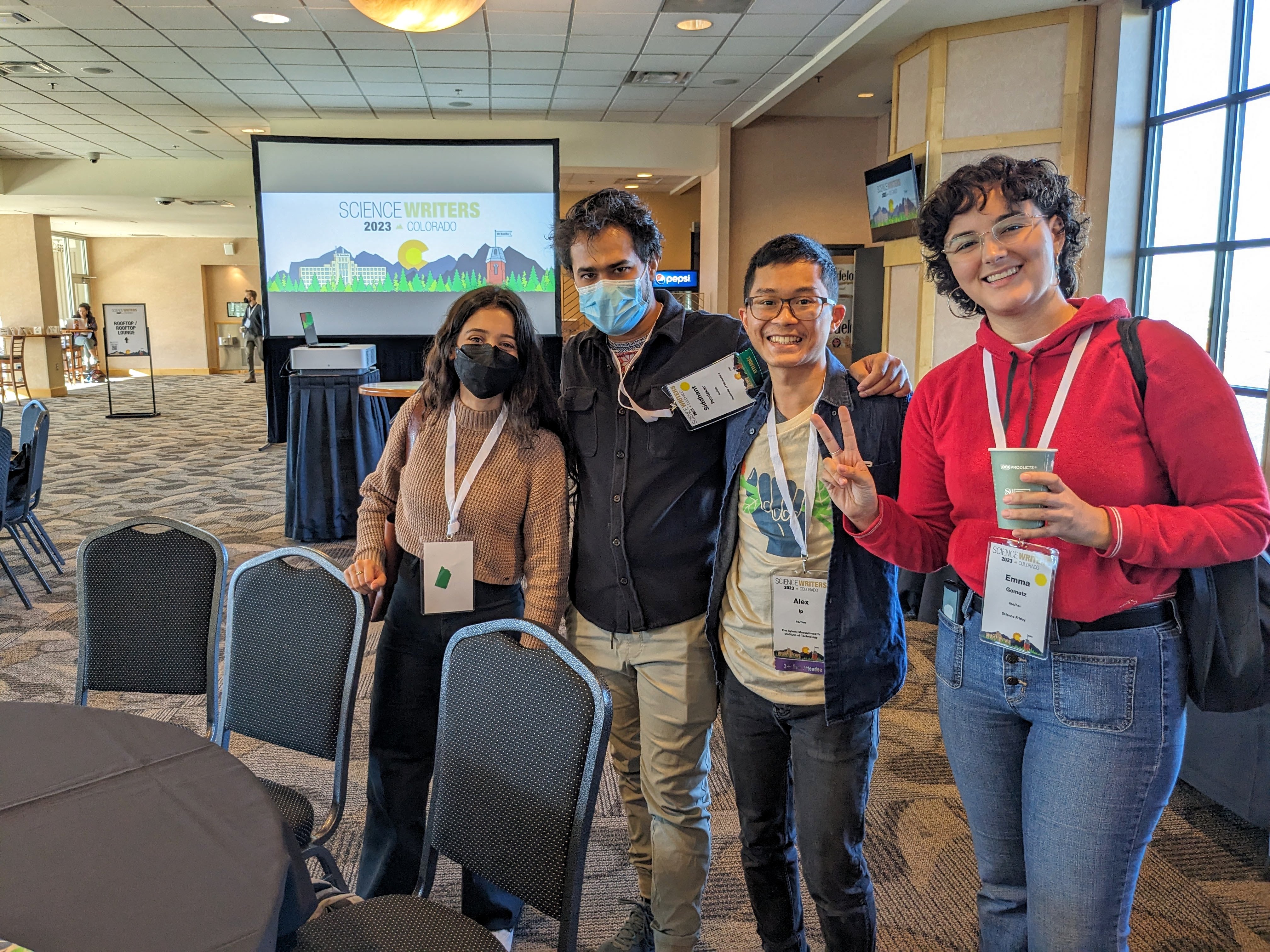 Friends of The Xylom and The Uproot Project gather in the Byron White Club at the University of Colorado's Folsom Field during a break