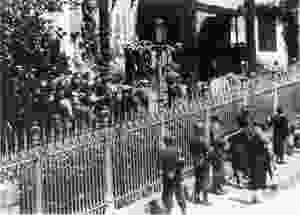 Hostages gathered in front of the mairie in Mussidan on 11 June 1944. Those on the left would be released. Those on the right with their hands in the air would be shot that evening. (Collection Patrice Rolli)
