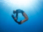 Tourist swimming in the crystal-clear Red Sea waters at Abu Dabbab Bay, Marsa Alam