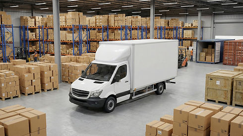 white-delivery-truck-busy-warehouse-with-stacked-boxes.jpg
