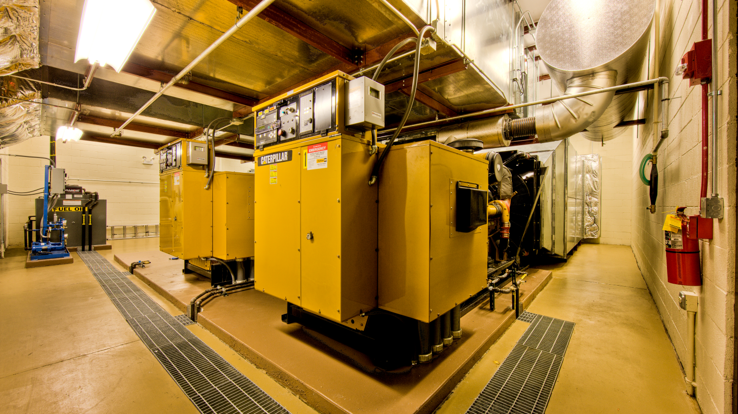 New emergency power plant featuring two 750 kW generators, a new paralleling switchboard, and day-tank fuel delivery system.