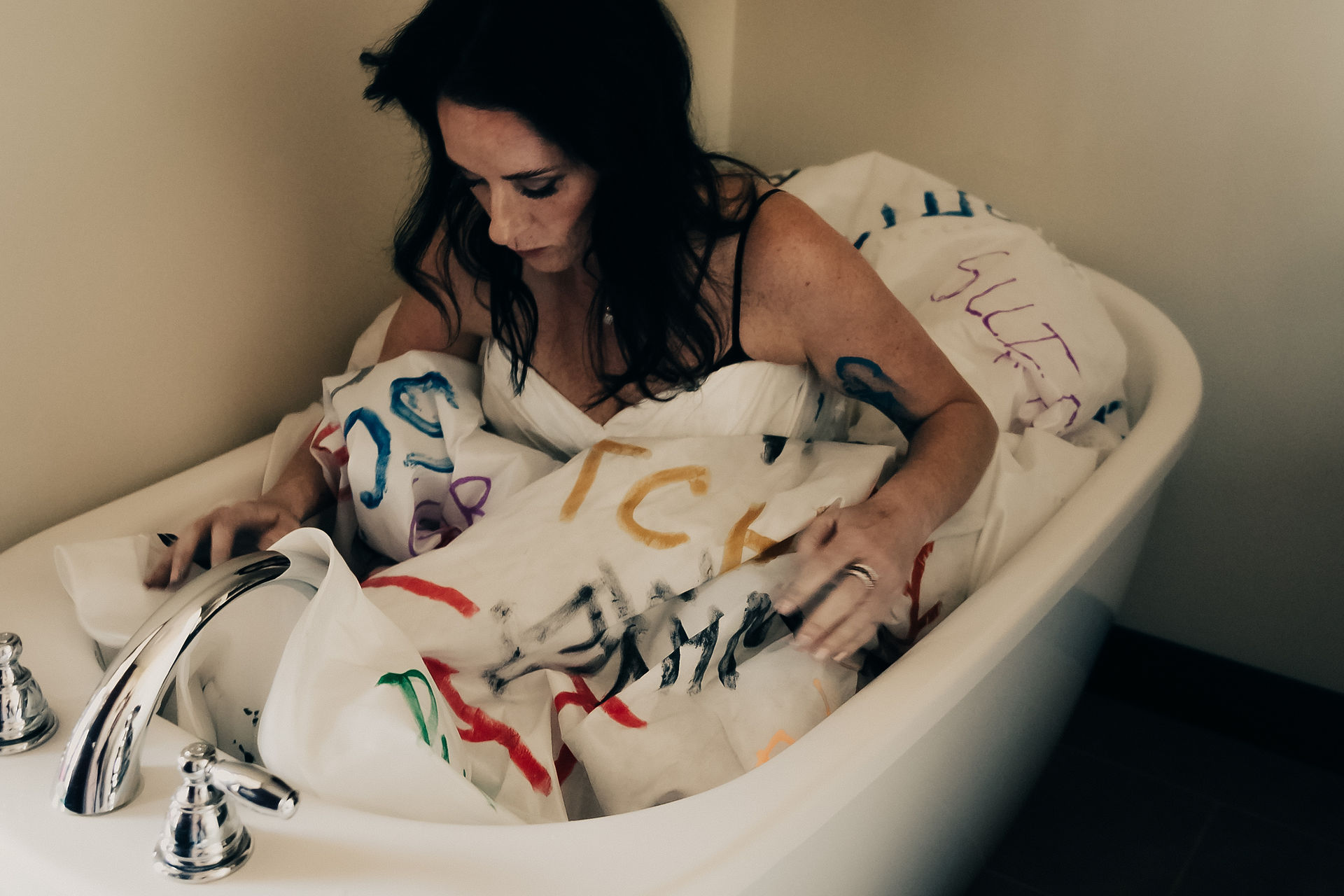 a woman getting in the bath