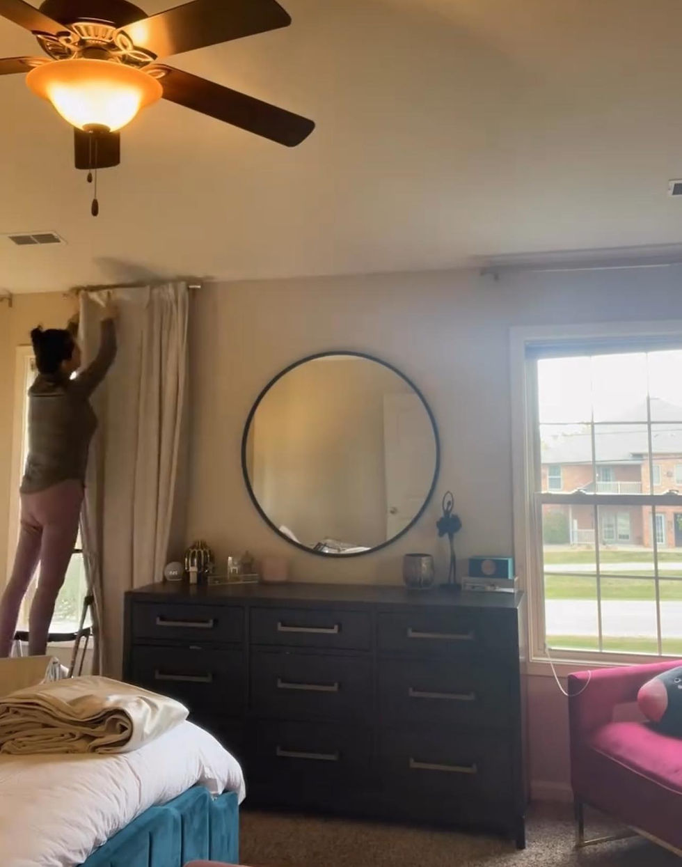 Hanging curtains in the bedroom