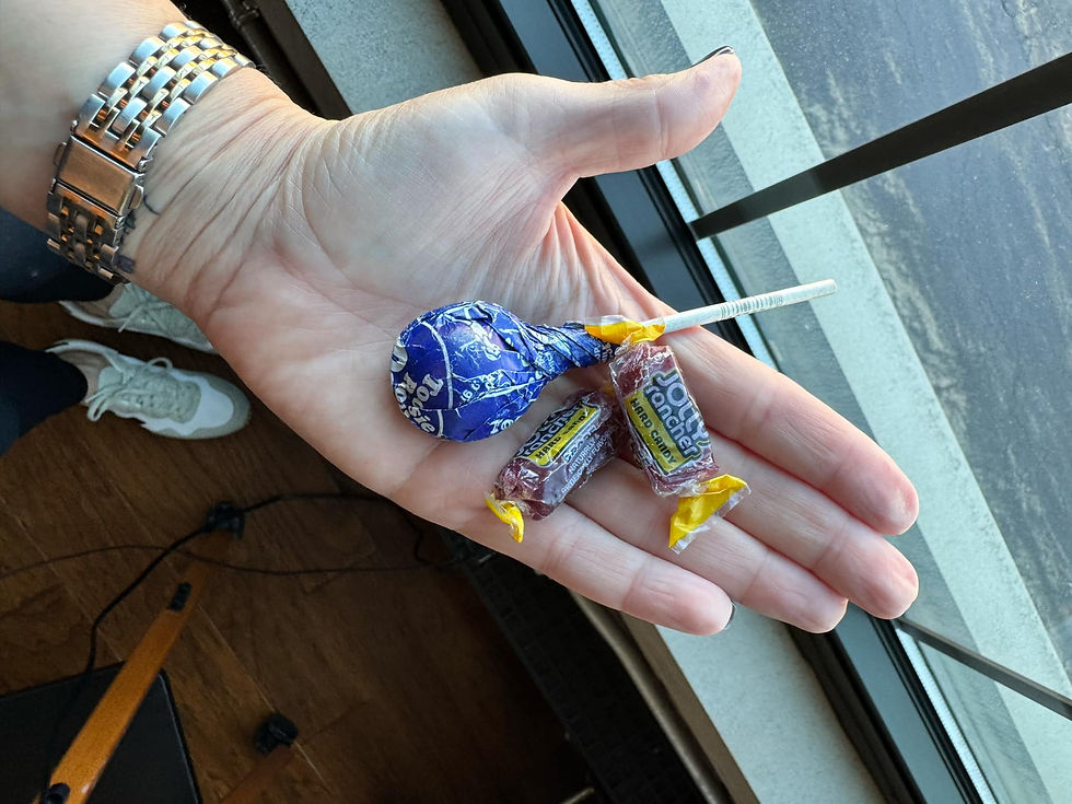 Grape candies in hand