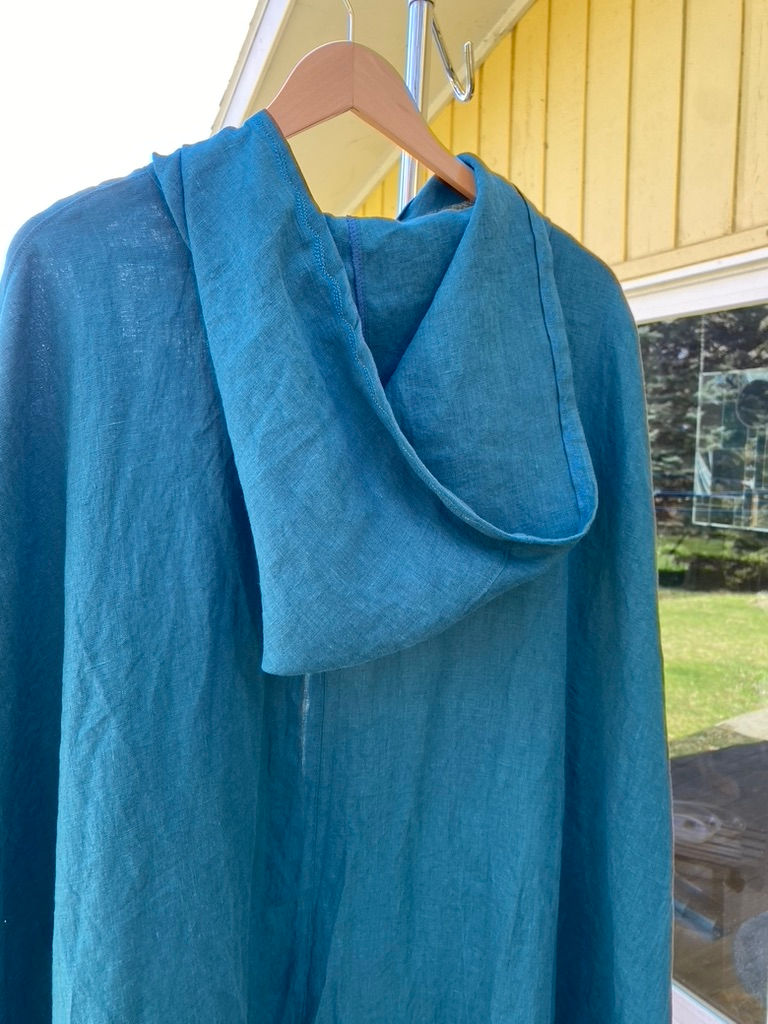 Thumbnail: SOLD. #244, teal unlined cape, hood, pockets, cape ties