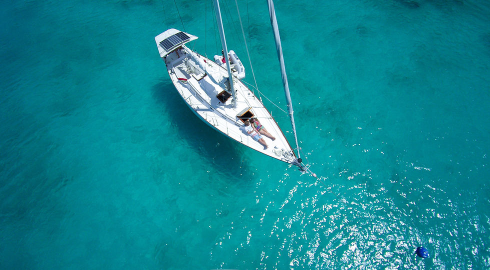 Sailboat On Turquoise Water