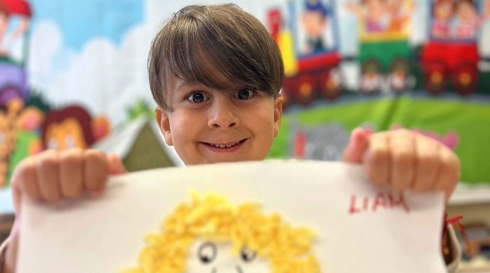 Happy child proudly displaying their colorful drawing at Little Manual LLC