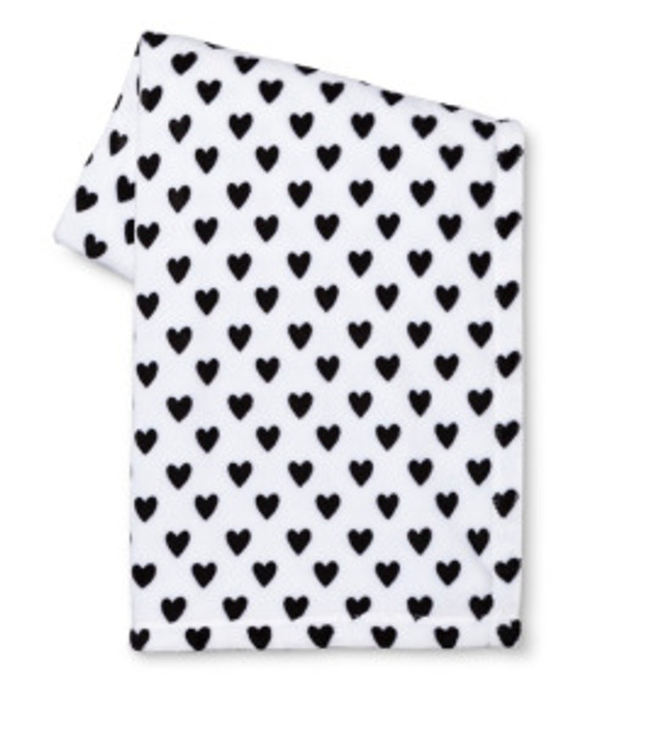 This blanket is warm and comfy. For under $20, it's a steal! Find yours here: http://m.target.com/p/valentine-s-printed-flannel-throw-black-and-white-hearts/-/A-49153822