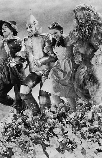 Ray-Bolger-arm-Judy-Garland-Jack-Haley.jpeg