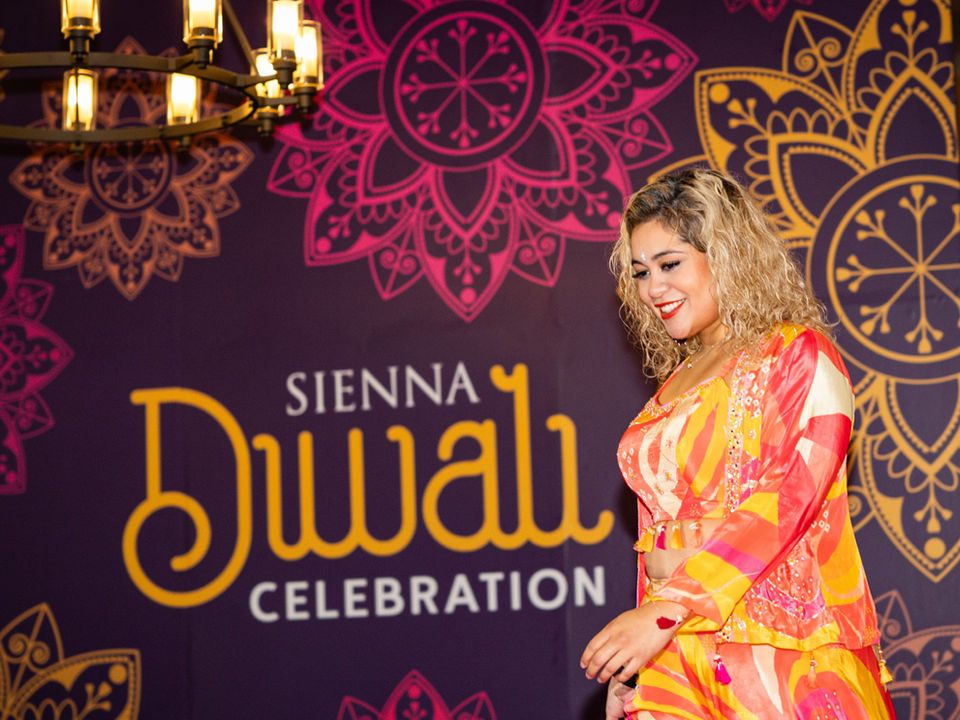 Model participating in the Sienna Diwali Celebration fashion show during the immersive cultural community event.