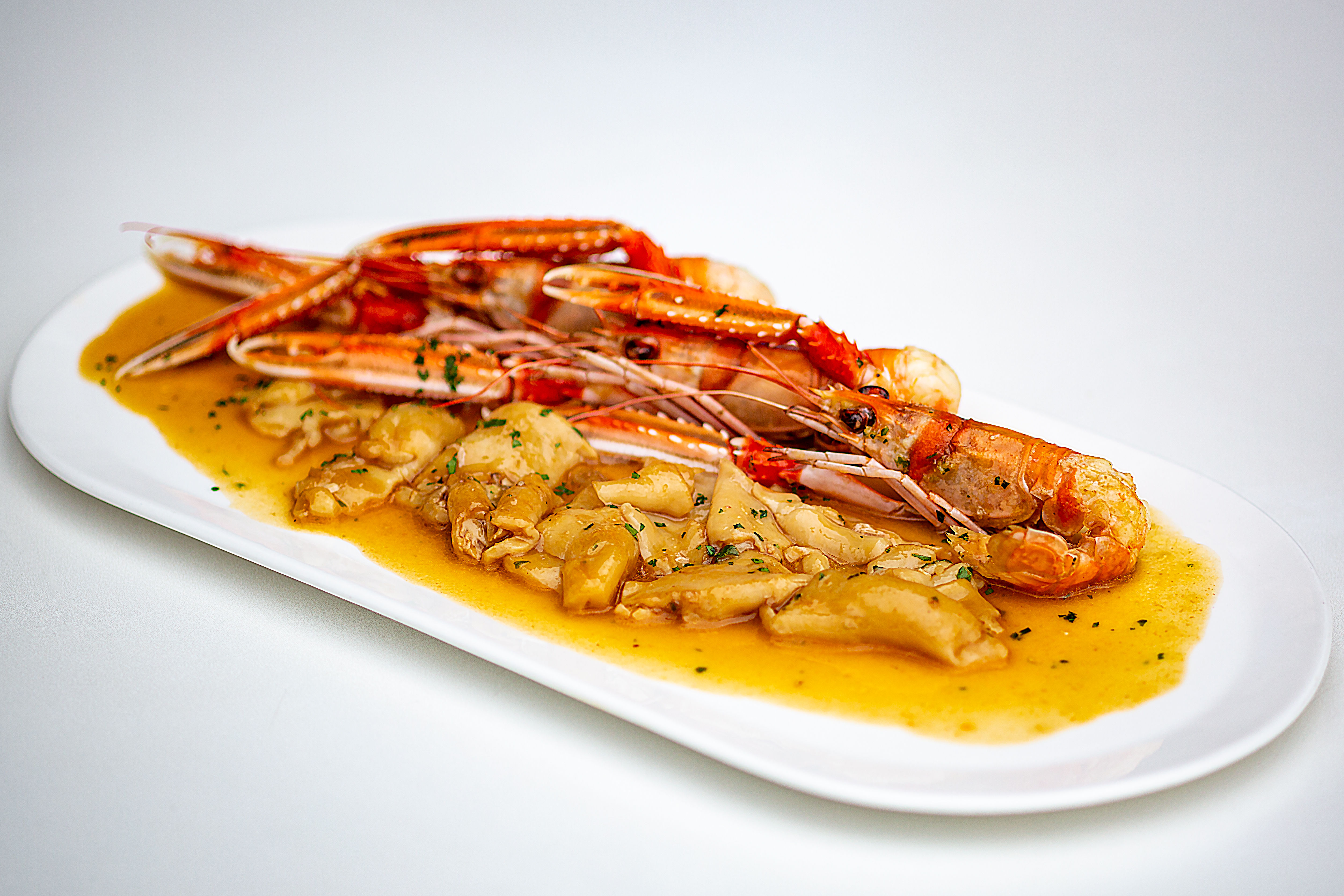 Tripa de bacalao con cigalitas de Palamós