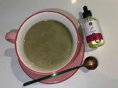 Matcha latte with Lavender on a plate with a teaspoon