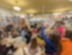 Kenneth Kraegel talks with a gathering of customers at storytime at Plumfield Books