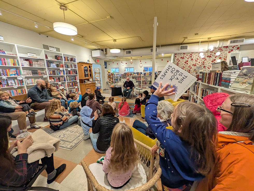 Kenneth Kraegel talks with a gathering of customers at storytime at Plumfield Books