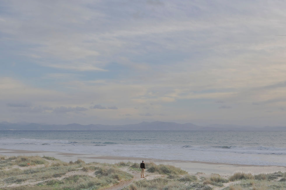 Man in dunes watching the horizon and the sea in South of Spain.
