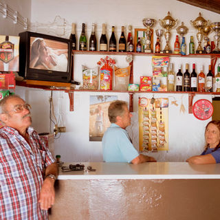 Bar tender and client, Mertola, Portugal.