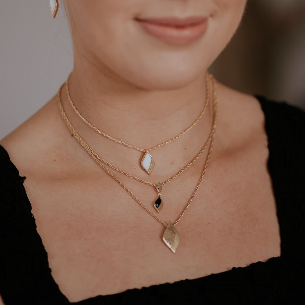 Thumbnail: Gold necklace with L&L signature shape pendant set with opal with brushed silver detail, worn by model