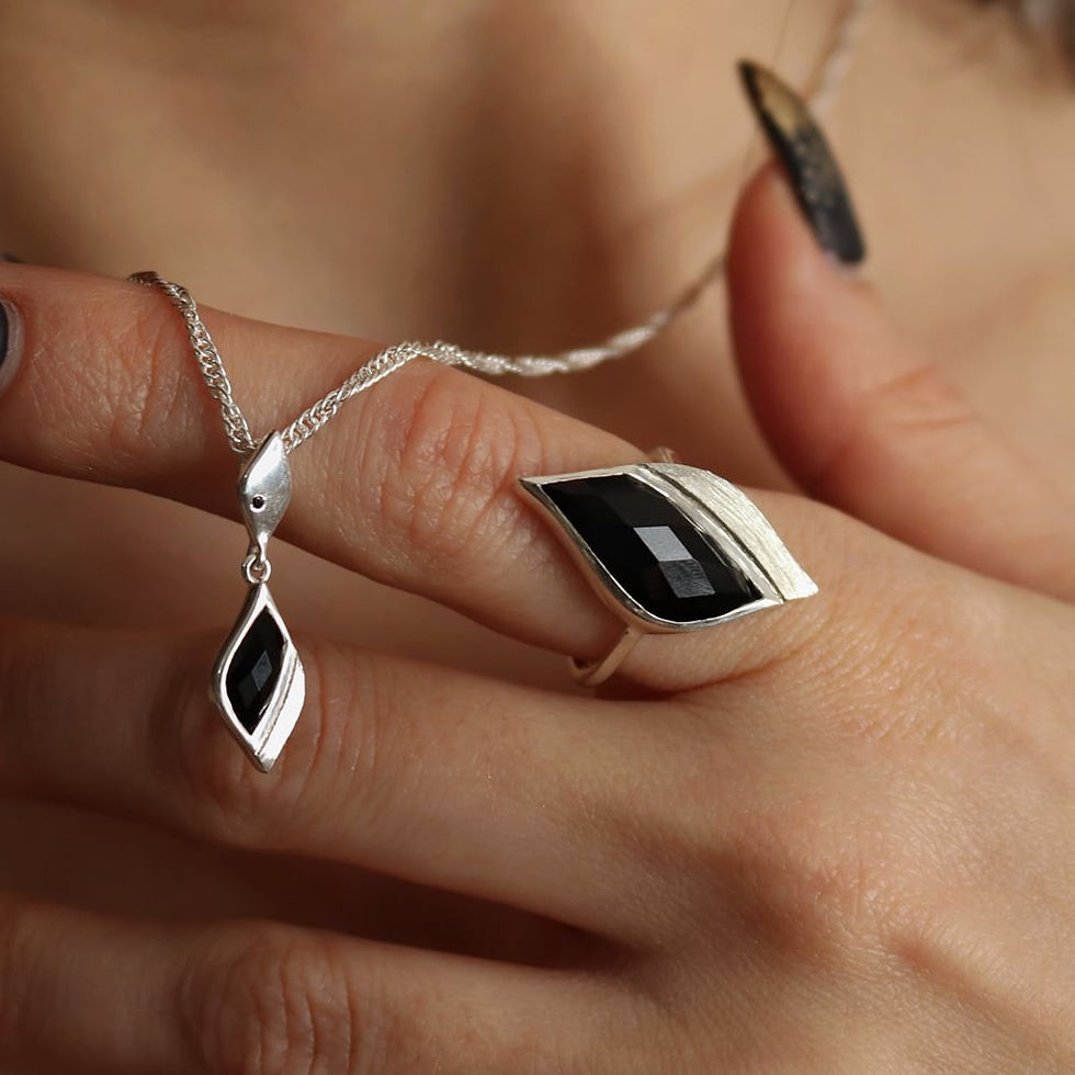 Thumbnail: Model wearing sterling silver necklace with dual drop pendant set with black onyx
