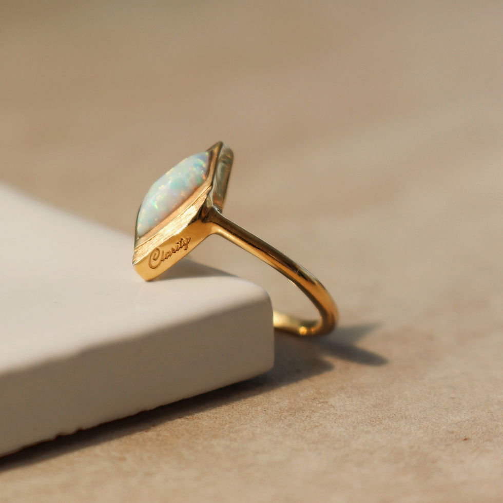 Thumbnail: Gold ring with opal stone cut in the unique Lustre & Love shape