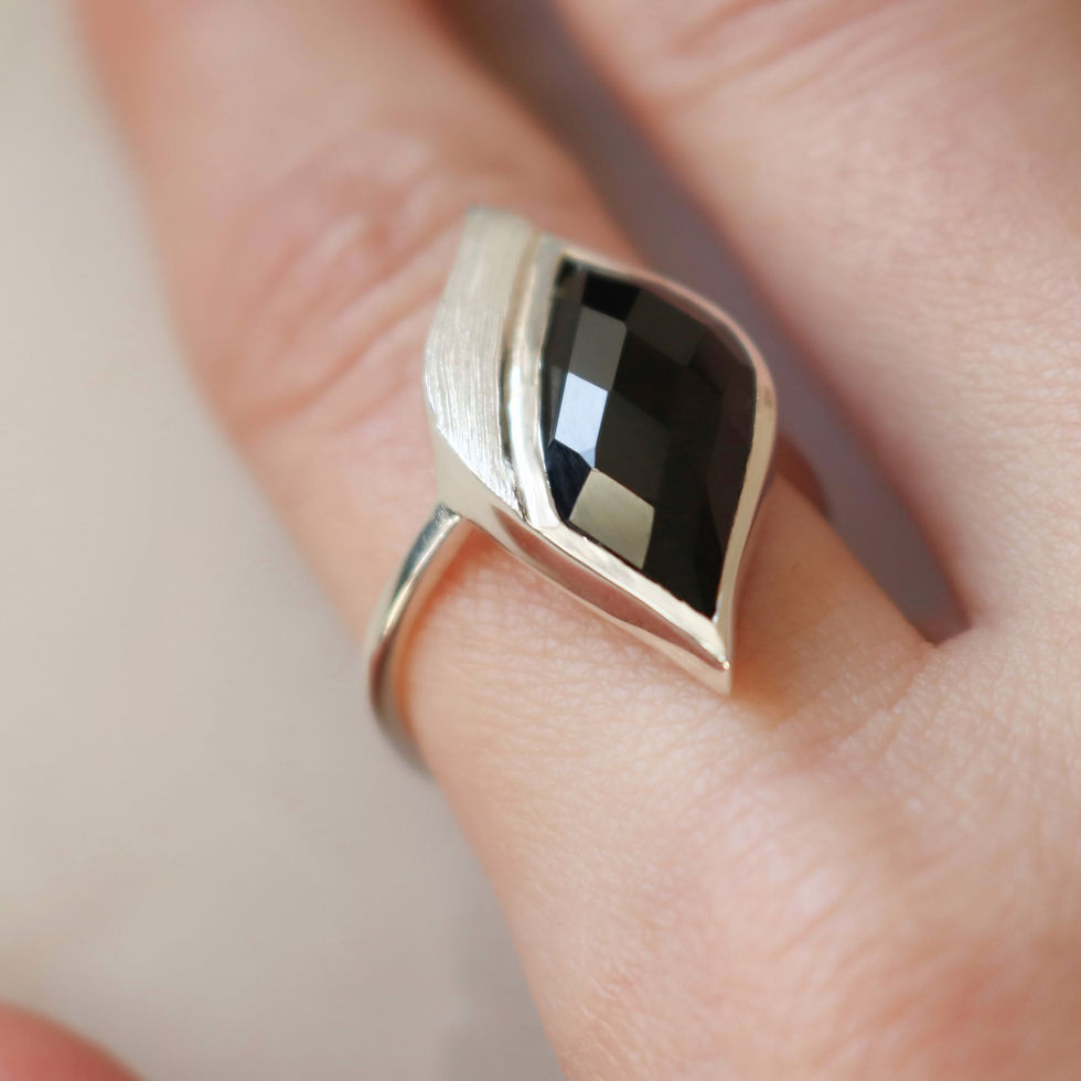 Thumbnail: Silver ring set with black onyx worn by model