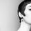 Thumbnail: a short haired girl wearing a geometric arch shaped earring