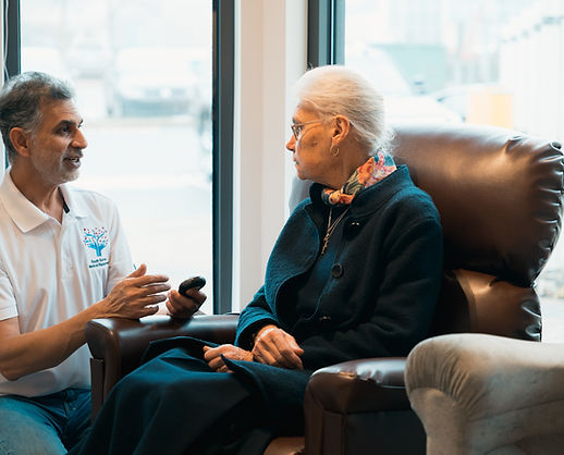 An SSME team member helps a customer try a lift chair in our South Surrey showroom
