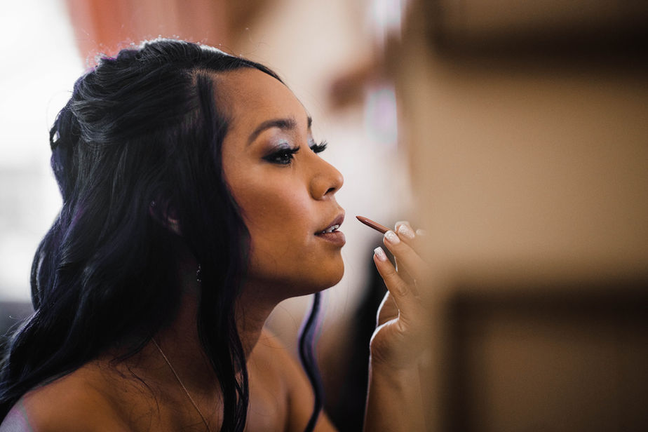 Bride wearing luminous soft glam makeup with neutral eyes and natural lashes by AN Artistry.