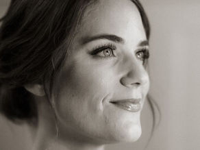 Bride with soft glam bridal makeup and elegant updo by A.N. Artistry at Firehouse at Fort Mason in San Francisco.