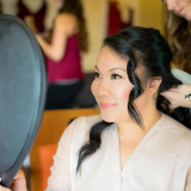 Bride with elegant updo and soft glam bridal makeup created by AN Artistry Bay Area makeup team.
