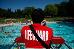 Lifeguard watching over pool