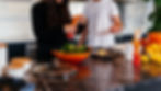 man and woman standing in front of table_edited.jpg