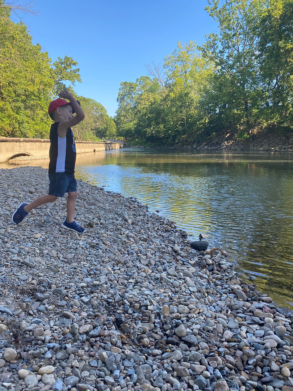 My son Deacon enjoying throwing rocks into the Roanoke River.