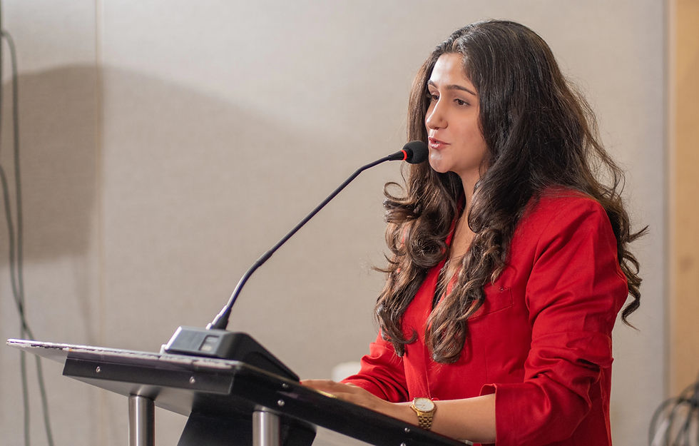 It's a me hosting an event in red blazer with mic.