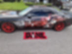 Black car with Bane themed wrap and matching custom rug