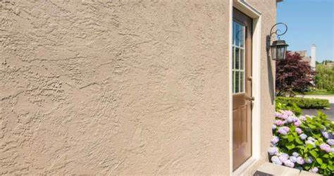 Eye-level view of cleaned stucco wall after thorough maintenance