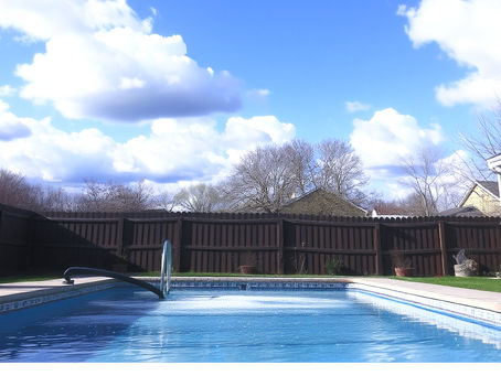 A backyard pool with a little pollen