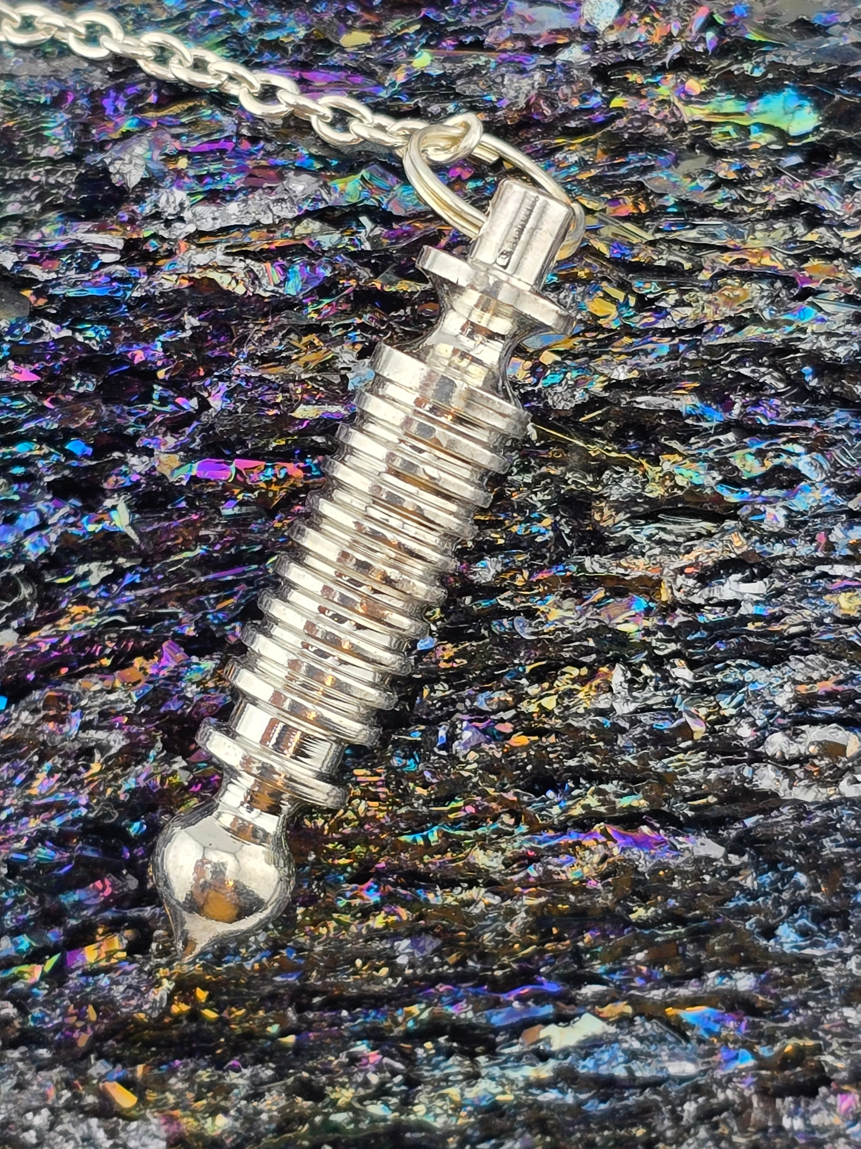 {energized} 12 Ring White Metal Pendulum