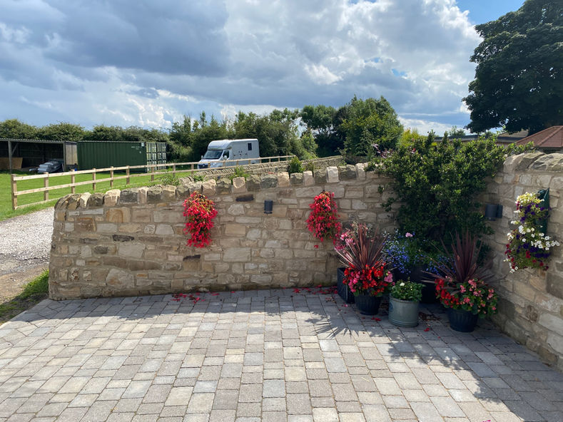 Stones placed beautifully to form a wall around the premises.