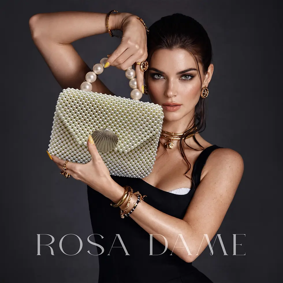 Model holding couture white pearl evening clutch by Rosa Dame with shell clasp detail.