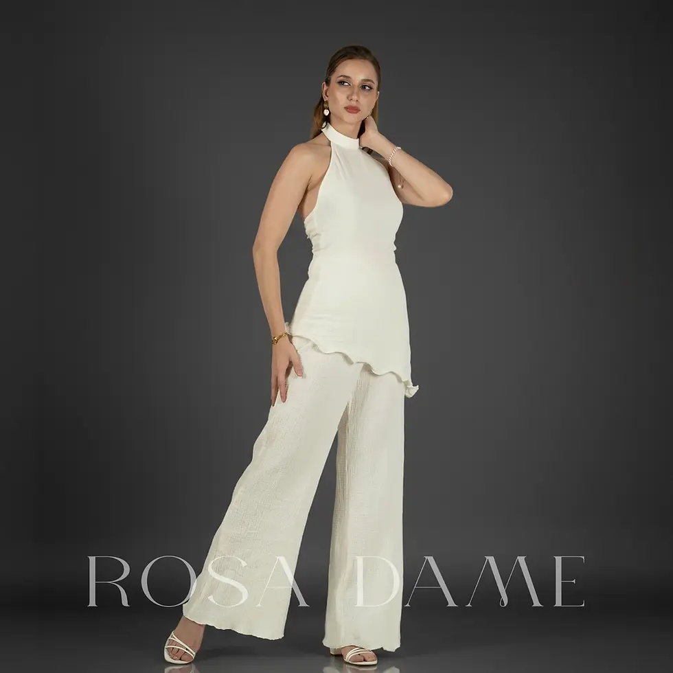 Ivory cotton crepe halter co ord set with wide leg trousers styled with pearl handbag