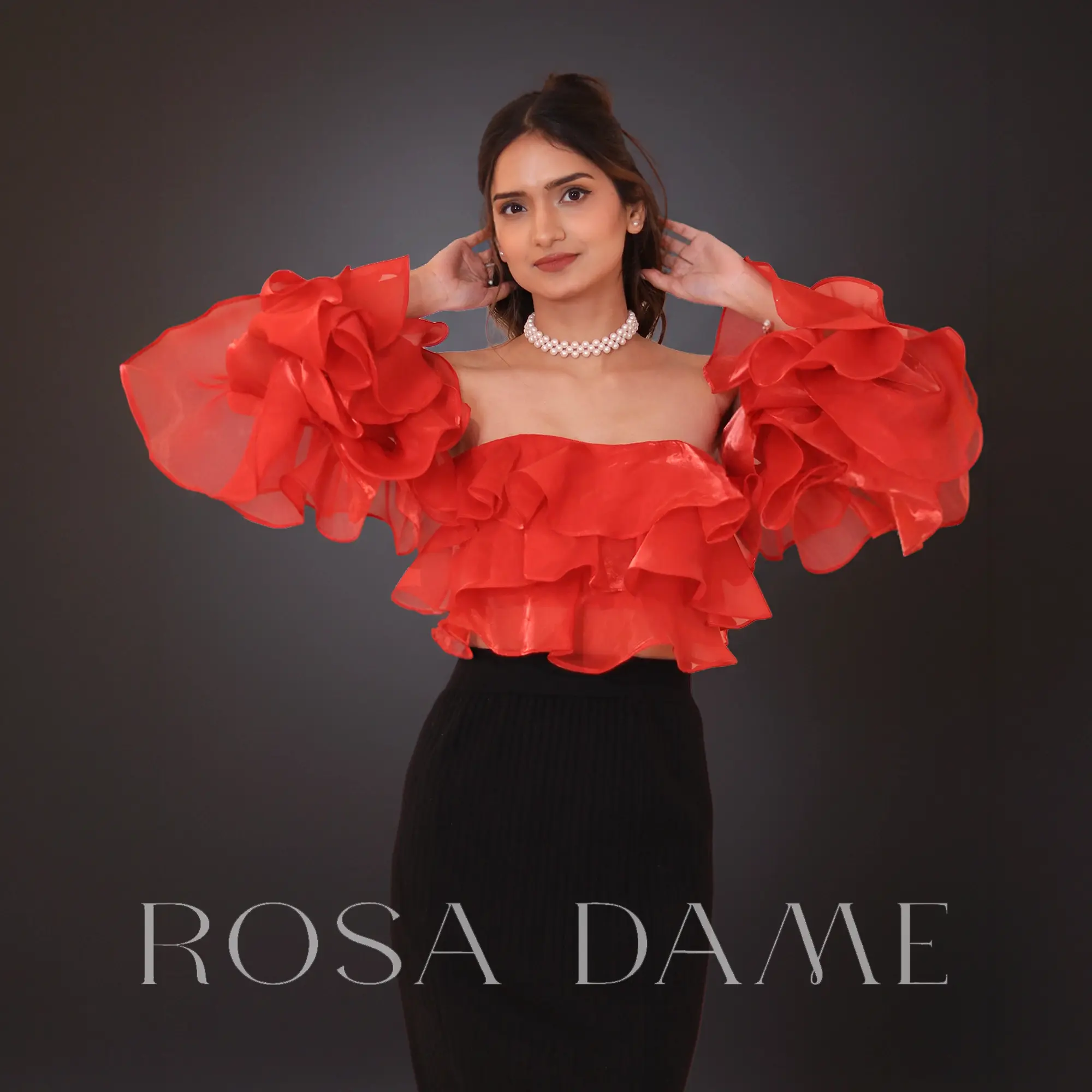 front view of red off shoulder organza corset top with layered ruffle sleeves