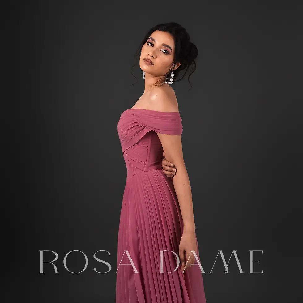 Side profile of rosewood pink georgette gown highlighting pleated drape and structured waist