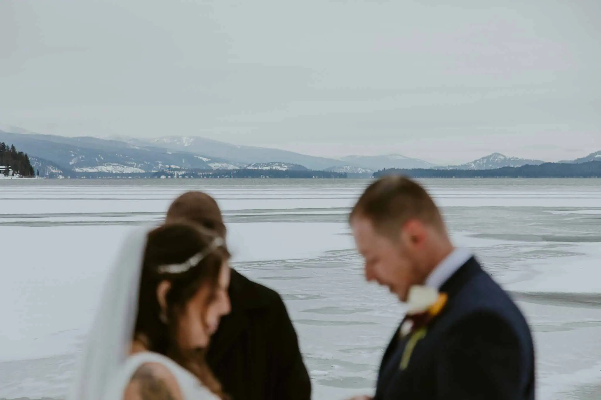 winter elopement ceremony on a beach
