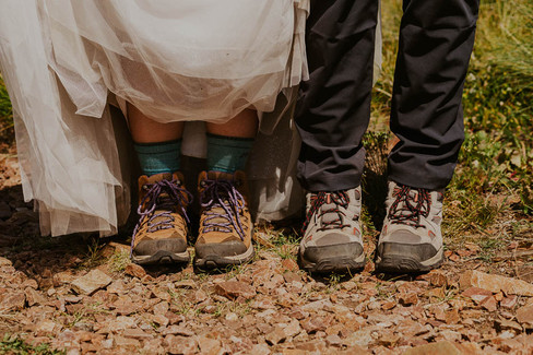 a bride and groom in hiking boots