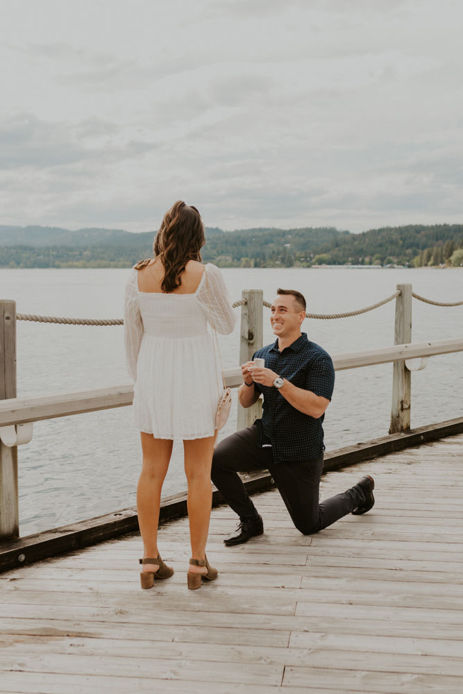 surprise proposal on the coeur d'alene resort boardwalk in north idaho, karlie larson photography
