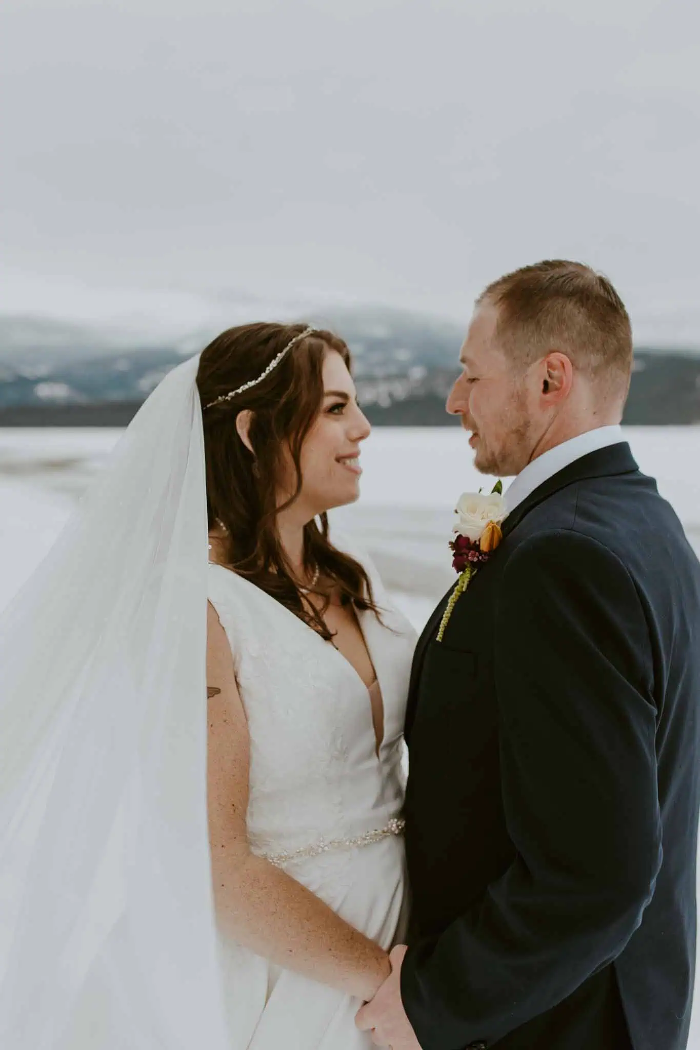 winter bridal portraits by a lake