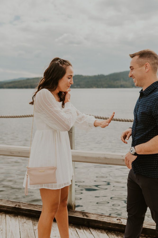 surprise proposal on the coeur d'alene resort boardwalk in north idaho, karlie larson photography
