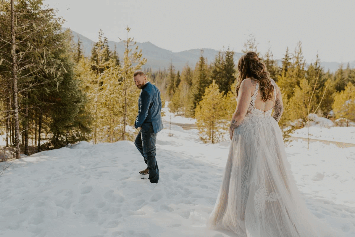 bride and groom first look in a snowy landscape gif