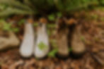 white and brown blundstone boots in ferns