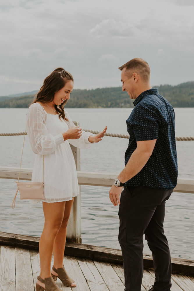 surprise proposal on the coeur d'alene resort boardwalk in north idaho, karlie larson photography